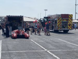 Participants view a fire engine and rescue boat during a Touch-a-Truck event at Buckeye Valley High School on June 3.