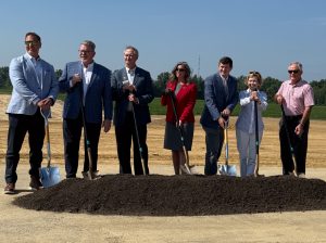 Photo of officials holding shovels during a groundbreaking ceremony.